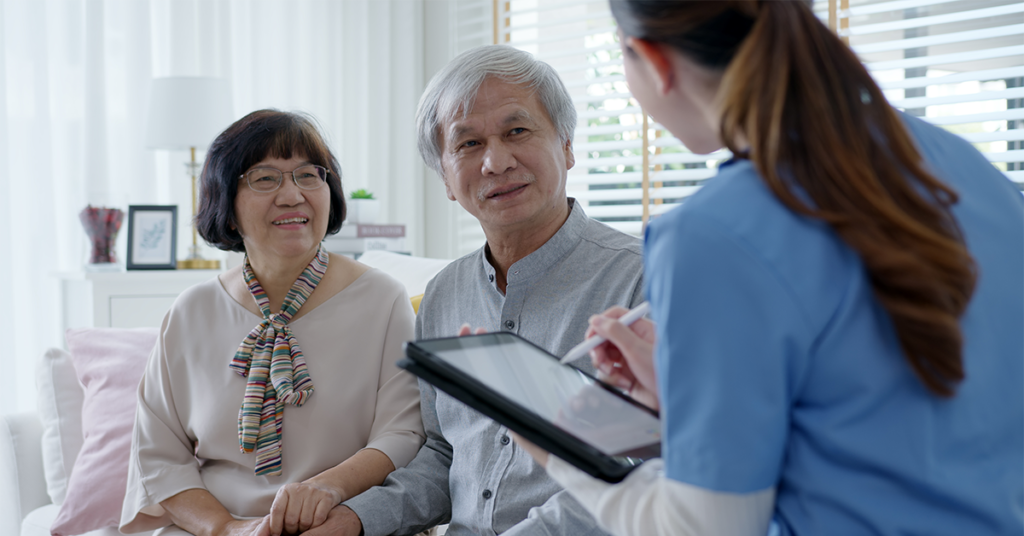 Young female nurse, assisted living, in-home carer or doctor visit old senior citizen at home talk about result follow up checklist, health care advice or prescription online on tablet computer.