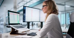 medical billing employee working at computer